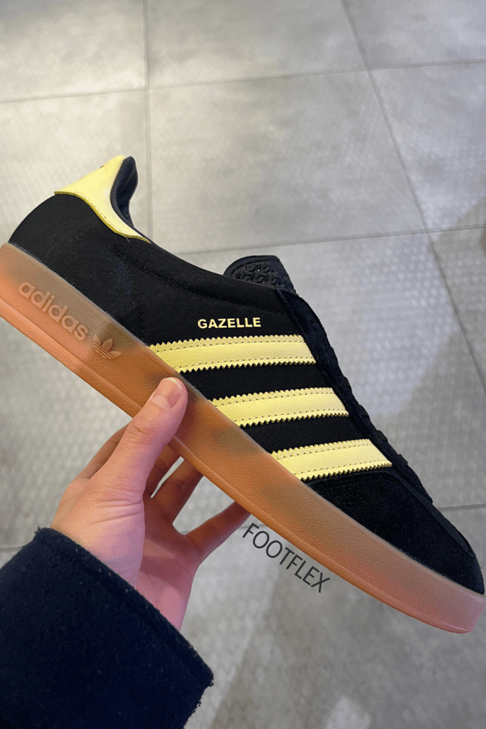 The legendary adidas Gazelle silhouette. A sneaker that’s travelled through different cultural fashion markets and still stays a timeless model. Carrying the original modes of the 1991 Gazelle, using the same materials and textures to craft together this classic. With a suede upper and synthetic overlay to piece the 3-stripe branding and instantly recognisable t-toe. This iteration comes in a black and yellow gum colourway.